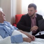 Terminal patient talking with notary about his last will